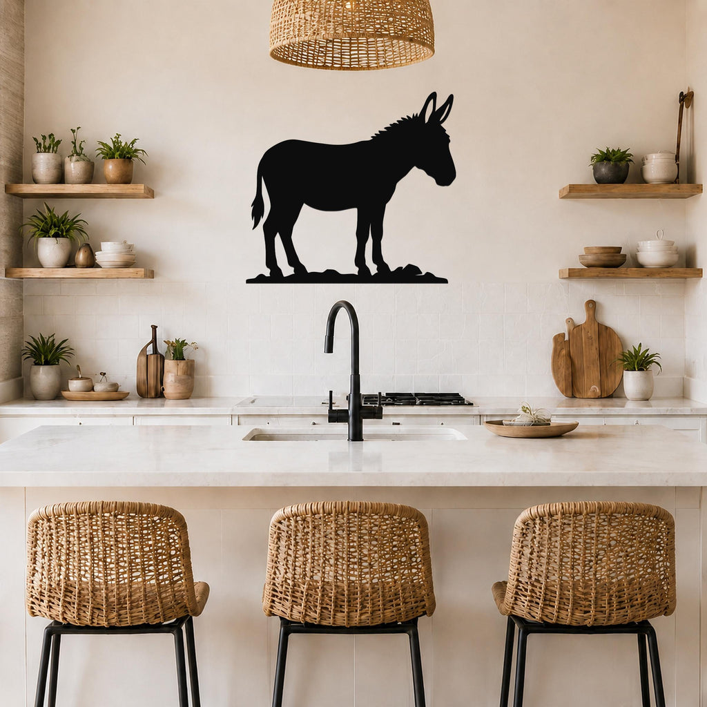 Black metal donkey silhouette wall art mounted above a kitchen counter, displayed in a rustic modern kitchen with woven bar stools and open shelving.