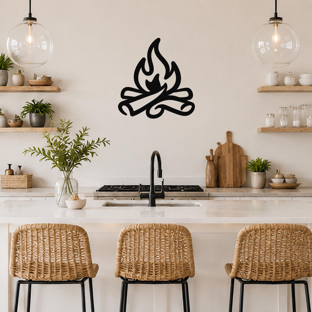 Black metal campfire silhouette wall art with flame and log cutouts, mounted on a kitchen wall above a counter.