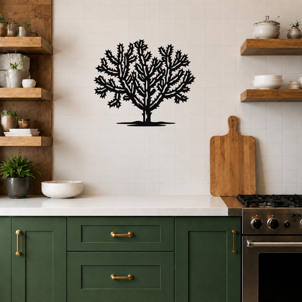 Black metal Cholla cactus wall art with intricate branching cutouts, mounted on a tiled kitchen wall above a counter.