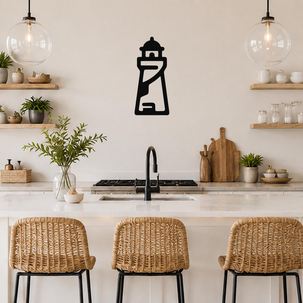 Black metal lighthouse wall art with internal cutout details, mounted on a kitchen wall above a counter.
