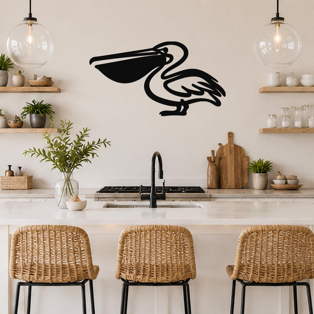 Black metal pelican wall art with a silhouette design, mounted on a kitchen wall above a counter with wicker bar stools.
