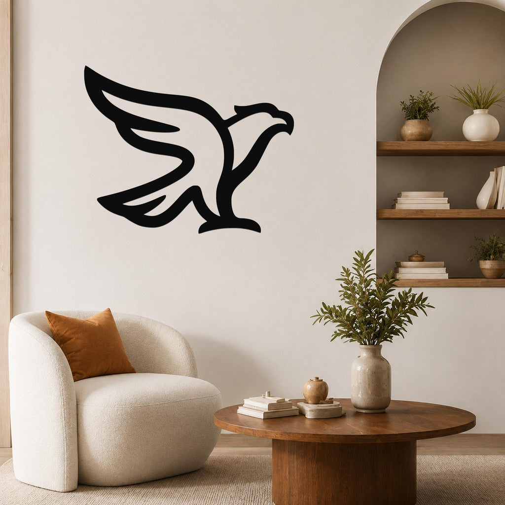 Black metal eagle wall art with a bold silhouette design, mounted on a living room wall above a white armchair.