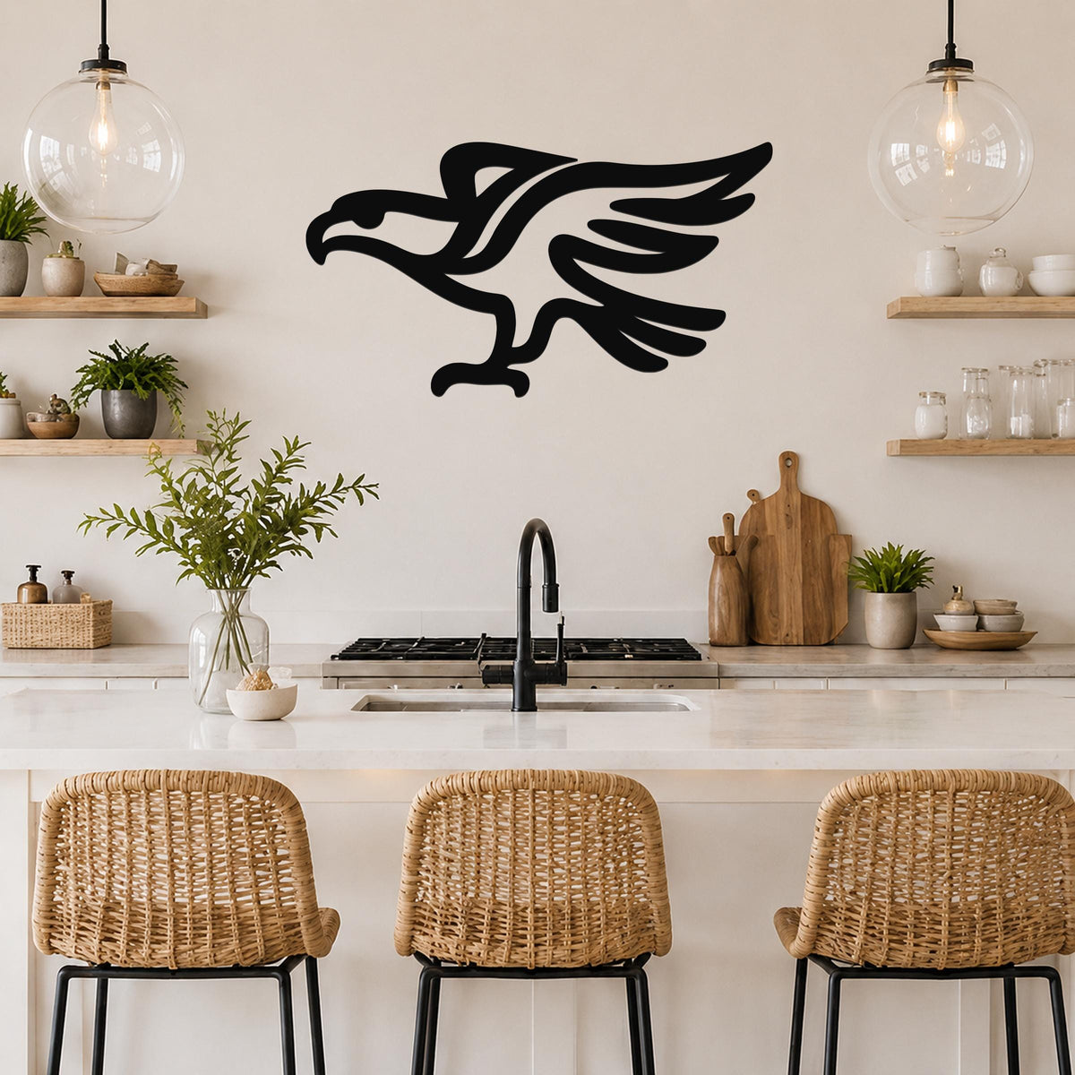 Black metal eagle wall art with a bold silhouette design, mounted on a kitchen wall above a counter with wicker bar stools.