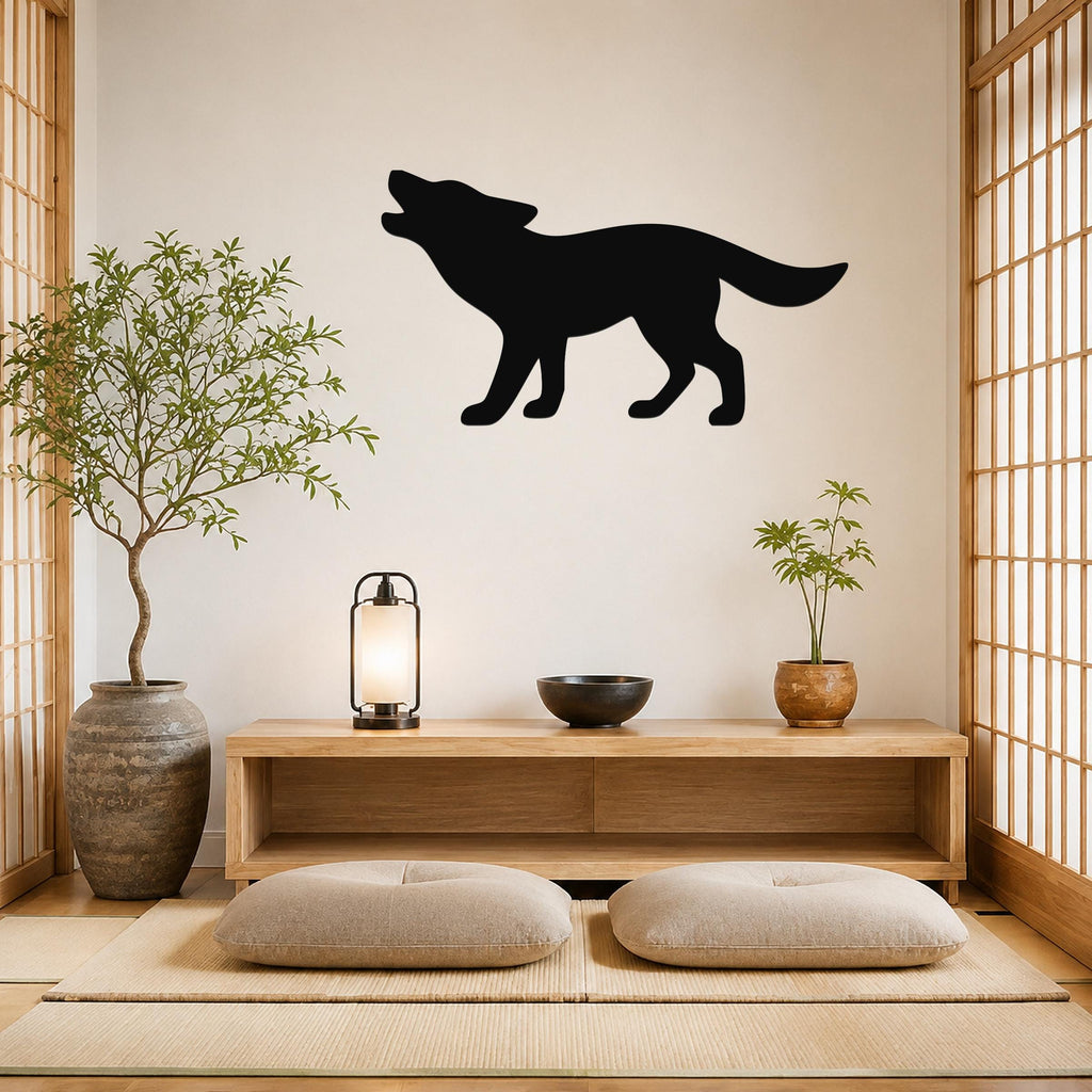 Black metal coyote wall art in a howling silhouette, mounted on a light-colored wall above a wooden console in a minimalist room with tatami mats and shoji screens.