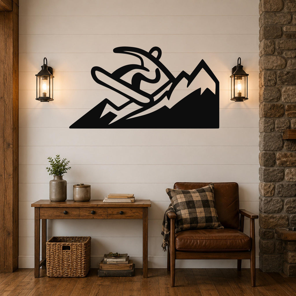 Black metal wall art with a snowboarder silhouette and mountain cutout, mounted above a wooden console table in a living room.