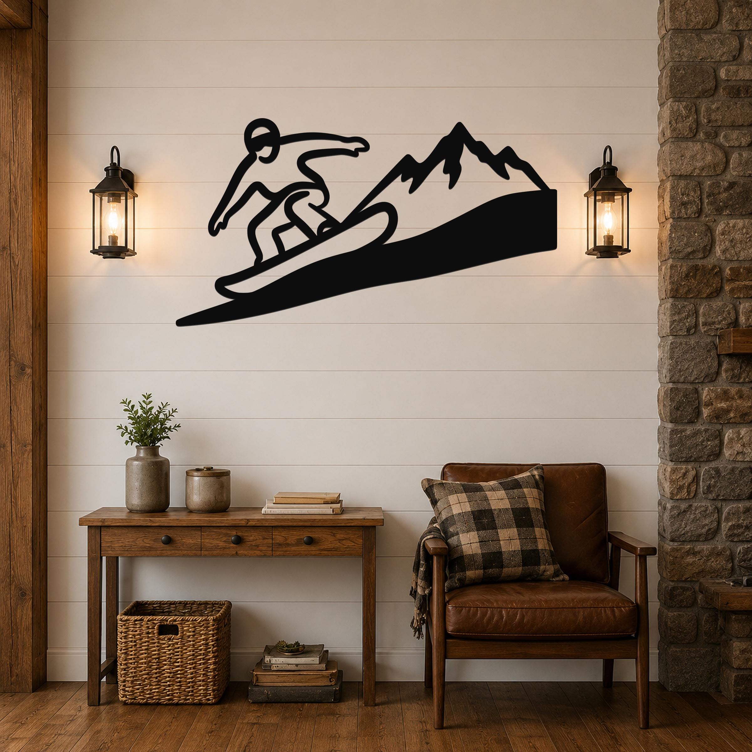 Black metal wall art featuring a snowboarder silhouette on a mountain slope, mounted above a wooden console table in a living room.