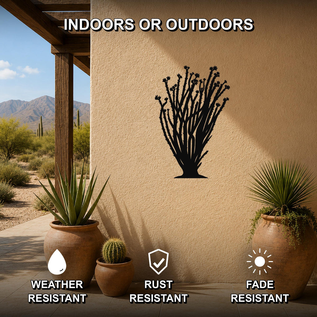 Black metal ocotillo wall art silhouette mounted on a stucco outdoor wall, displayed on a patio with potted plants and desert scenery in the background.