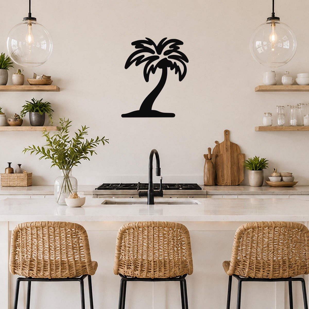 Black metal palm tree wall art silhouette mounted on a kitchen wall above a counter, with wicker bar stools and open shelves visible.