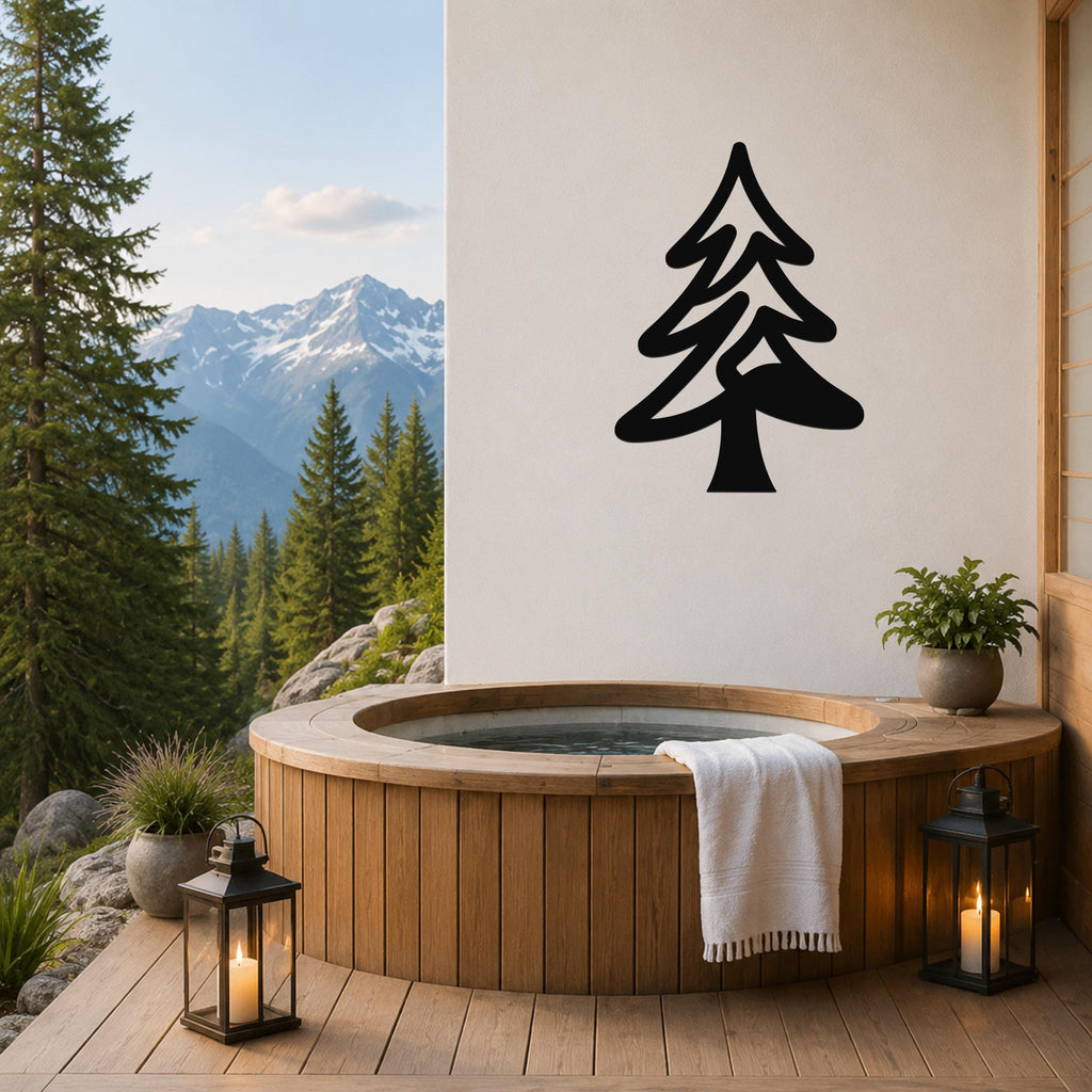 Black metal pine tree wall art silhouette mounted on a white wall above a wooden hot tub on a mountain-view deck.