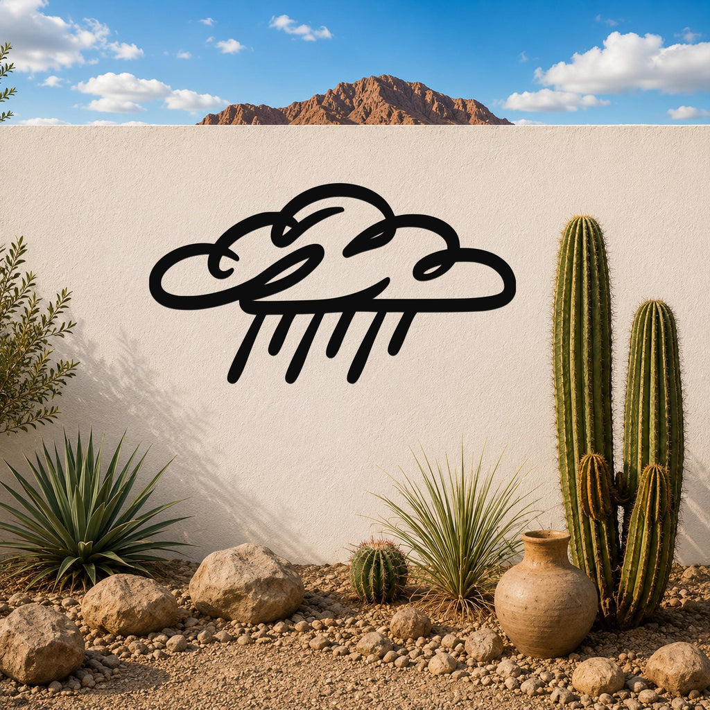 Black metal rain cloud wall art with raindrop cutouts, mounted on a white outdoor wall in a desert garden setting.