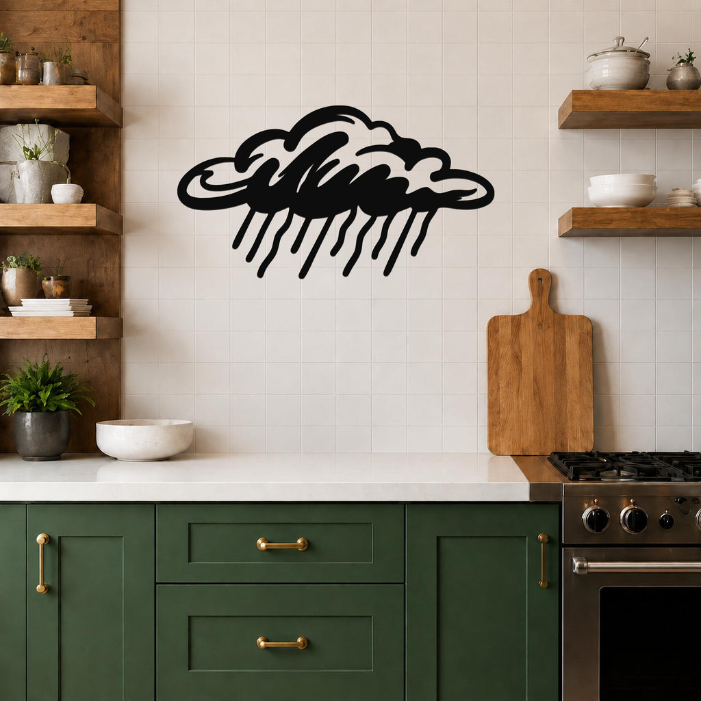 Black metal rain cloud wall art with raindrop cutouts, mounted on a tiled kitchen wall above a counter.