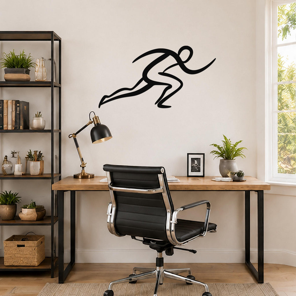 Black metal runner wall art with motion-line cutouts, mounted above a wooden desk in a home office.