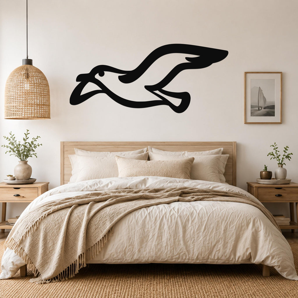 Black metal seagull wall art with motion-line cutouts, mounted above a bed in a neutral bedroom.