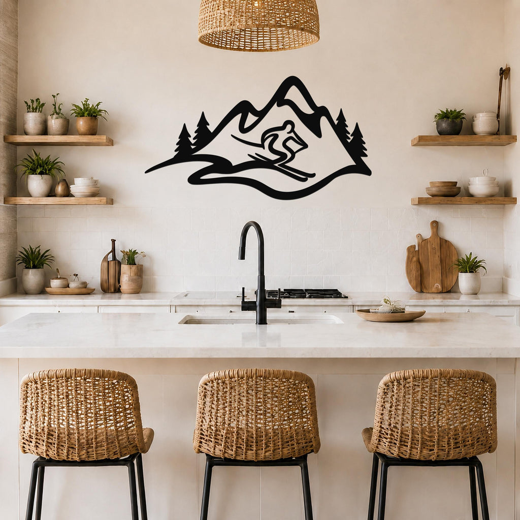 Black metal wall art featuring a skier silhouette descending a mountain with pine trees, mounted above a kitchen counter.