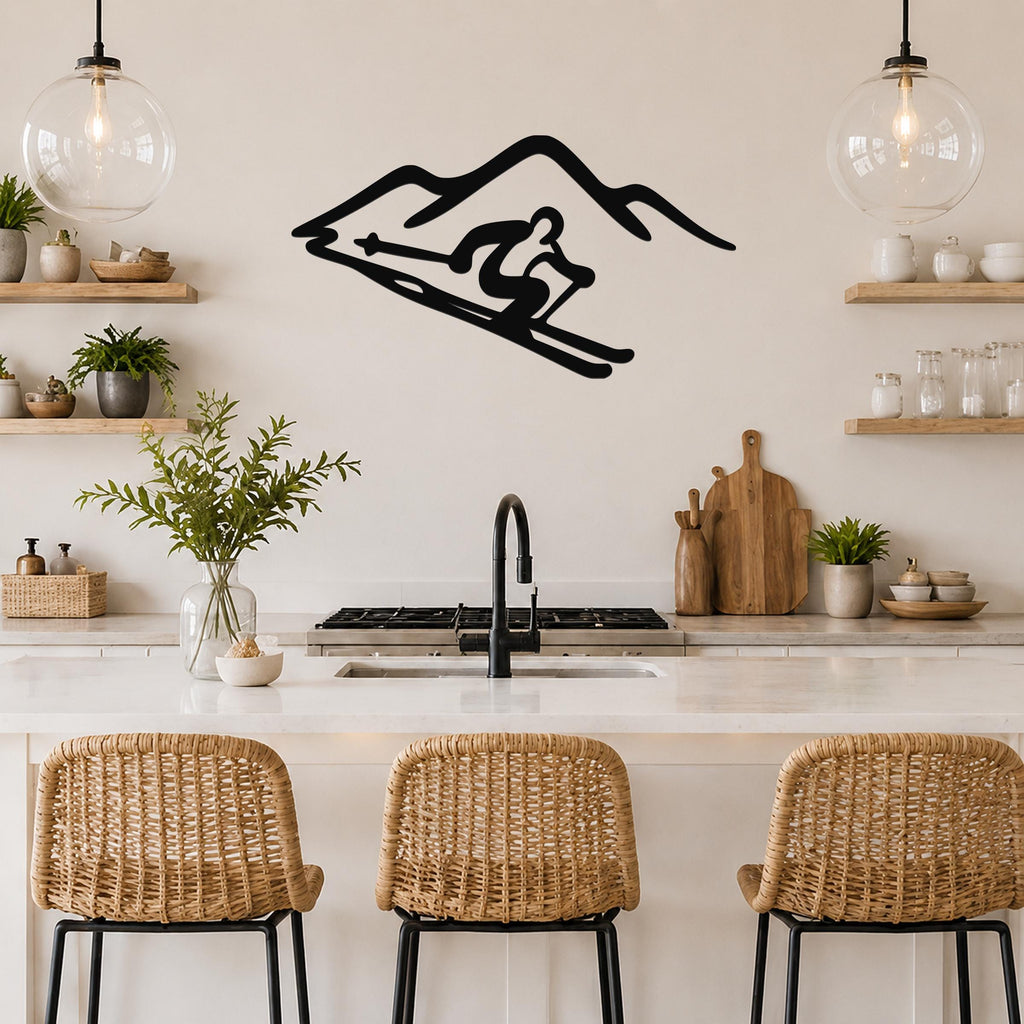 Black metal wall art featuring a skier silhouette in motion, mounted above a kitchen counter with wicker bar stools and open shelving.