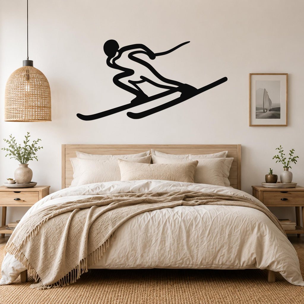 Black metal skier silhouette wall art with motion lines, mounted above a bed in a neutral bedroom.