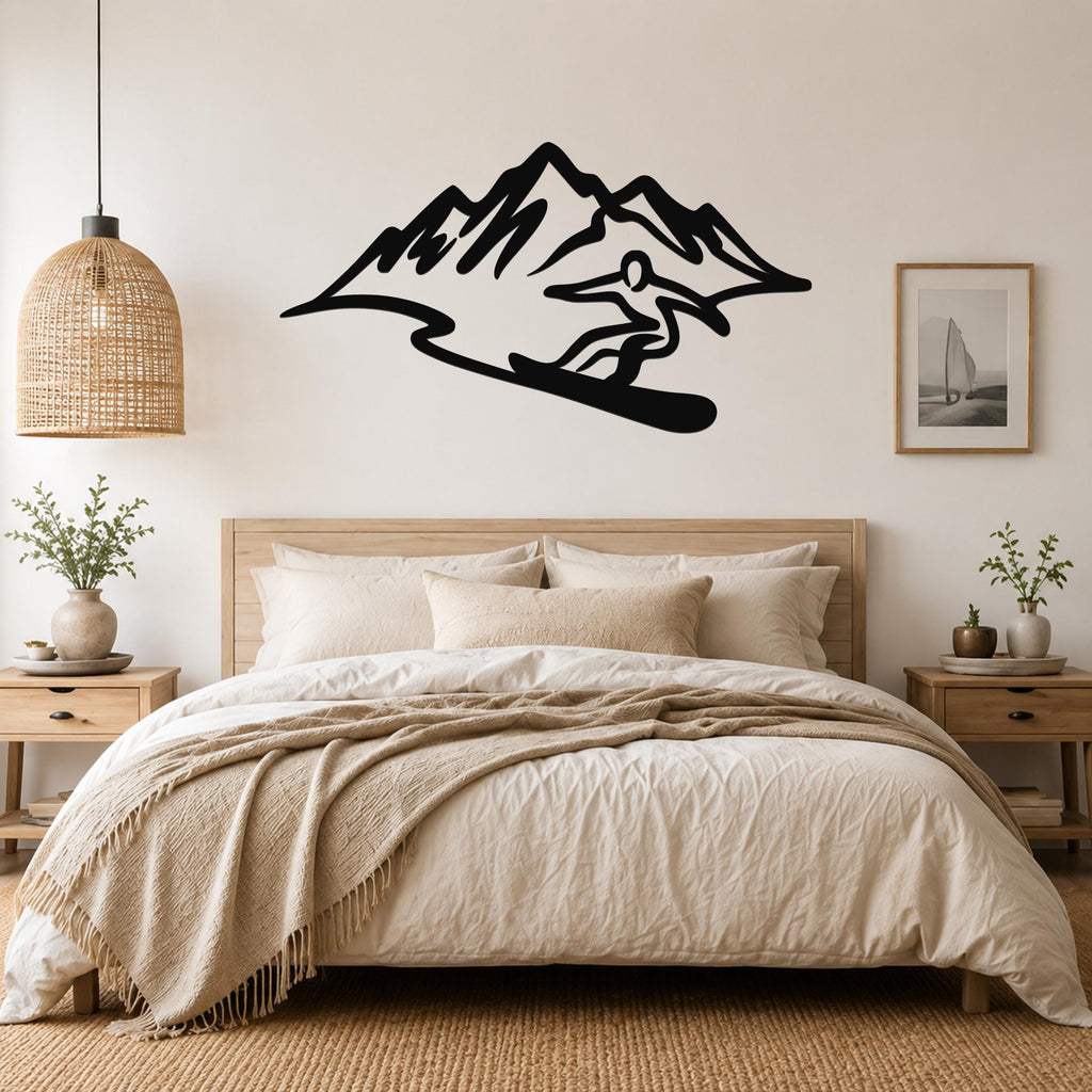 Black metal wall sculpture of a snowboarder in silhouette, mounted above a bed in a bedroom.