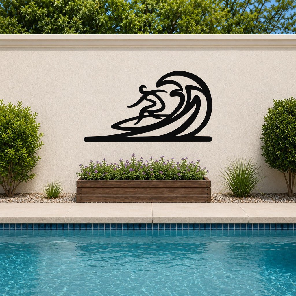 Black metal surfer wall art with flowing wave cutouts, mounted on an outdoor wall above a poolside planter.
