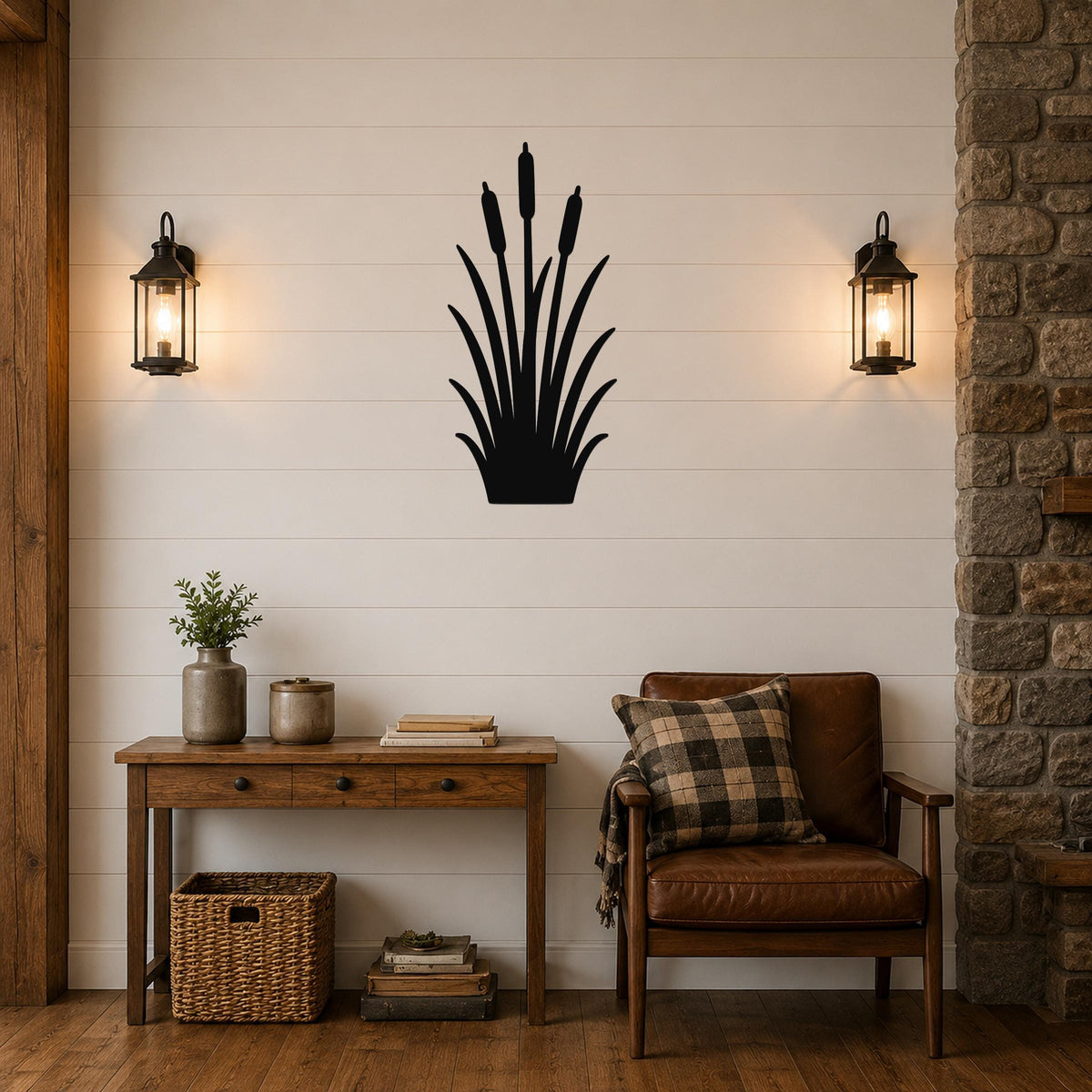 Black metal cattail wall art silhouette mounted on a shiplap wall above a wooden console table in a living room.