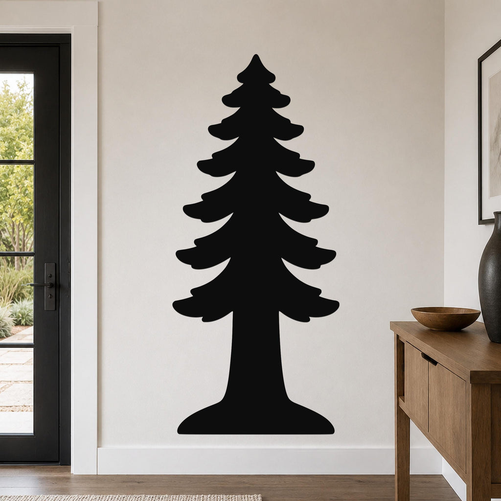 Black metal redwood tree wall art silhouette mounted on a light-colored wall in a modern entryway, above a wooden console table.