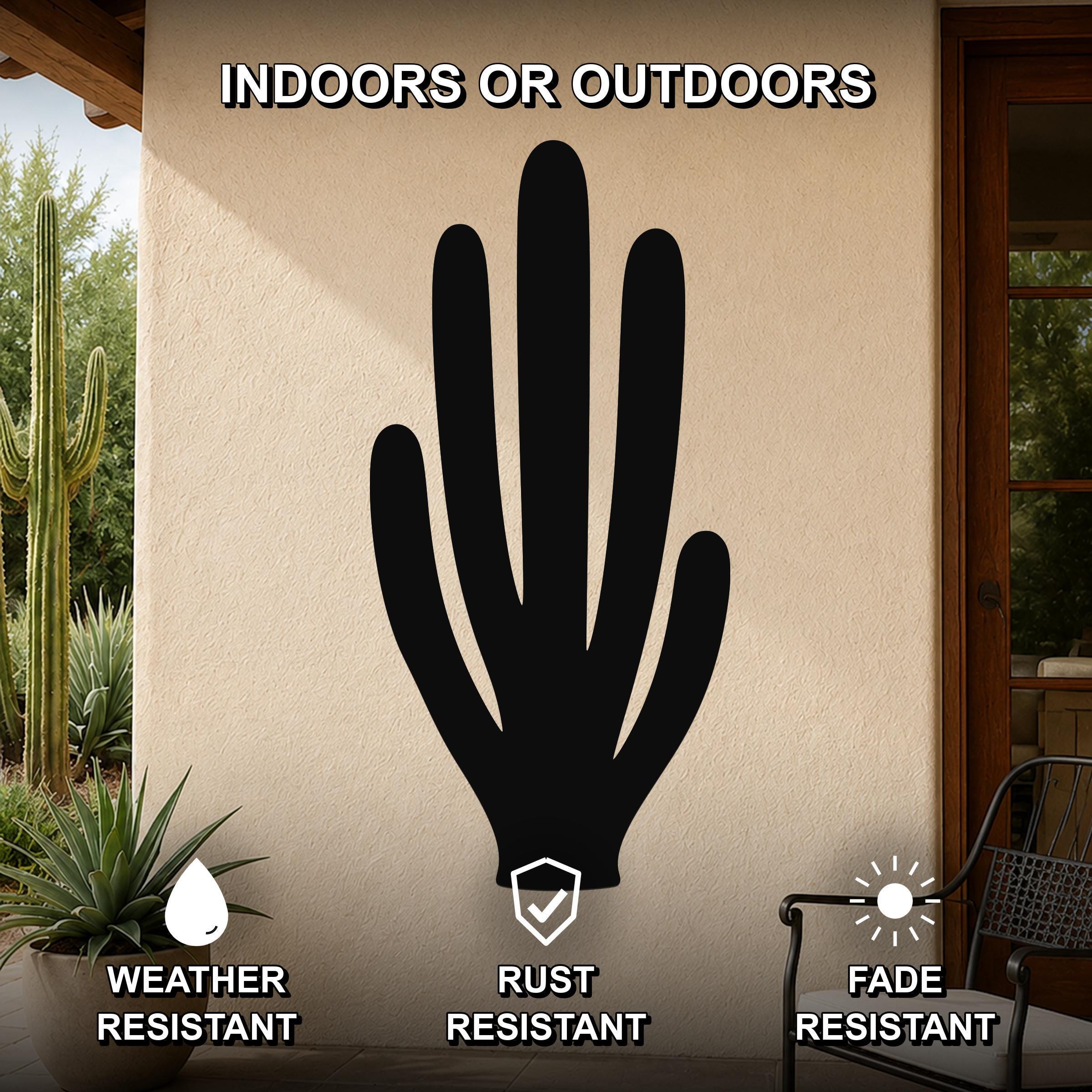 Black metal organ pipe cactus wall art with cutout branches, mounted on an outdoor patio wall with weather, rust, and fade resistance labels.