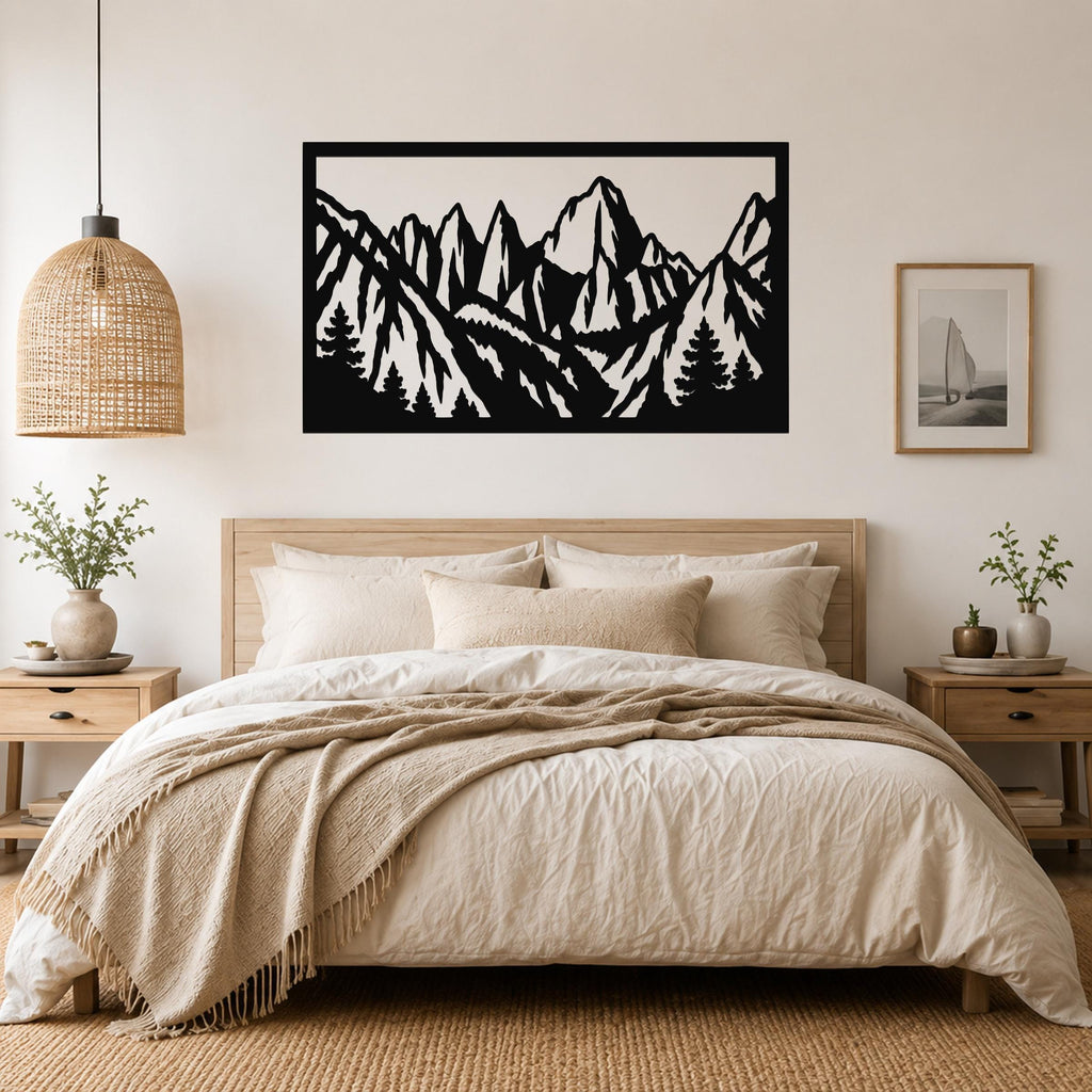Black metal wall art with a mountain range silhouette, mounted above a bed in a bedroom.