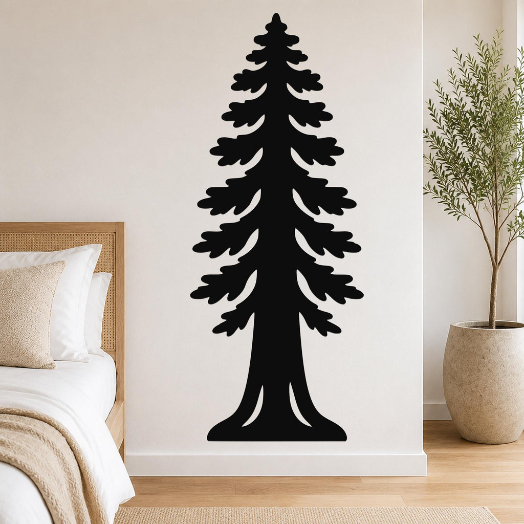 Black metal wall art of a sequoia tree silhouette with layered branches and a wide base, mounted on a bedroom wall above a bed.