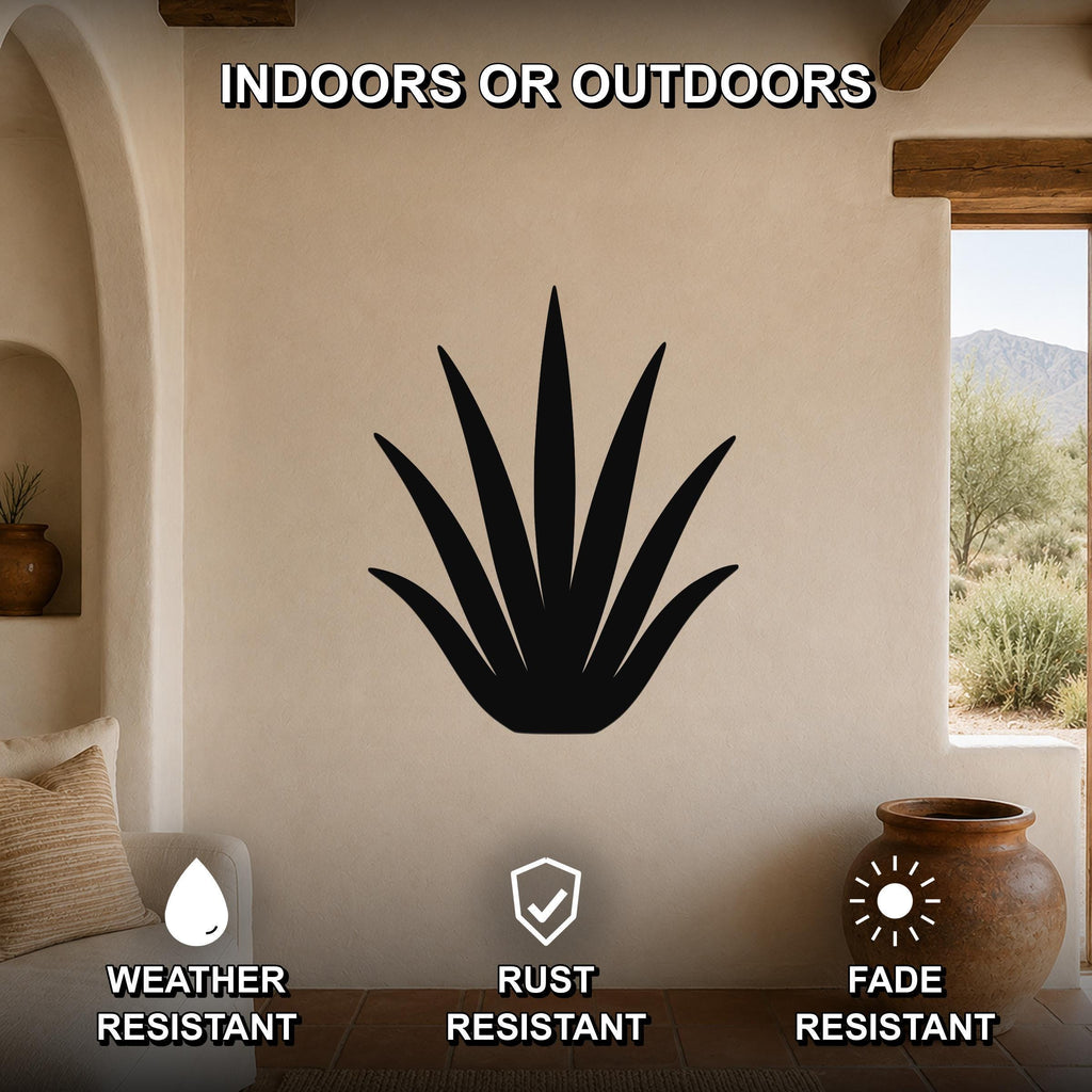 Black metal agave wall art silhouette mounted on a beige stucco wall in a living room, with text indicating it is weather, rust, and fade resistant for indoor or outdoor use.