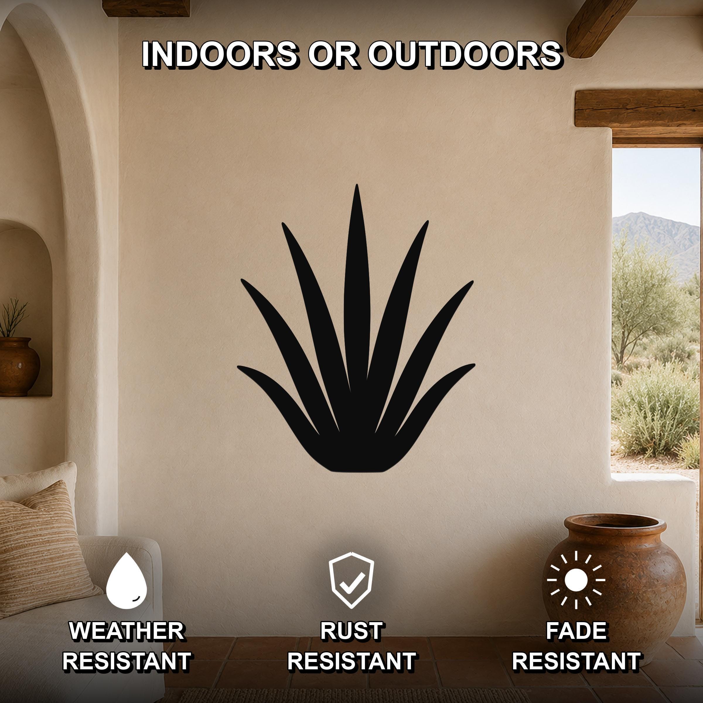 Black metal agave wall art silhouette mounted on a beige stucco wall in a living room, with text indicating it is weather, rust, and fade resistant for indoor or outdoor use.