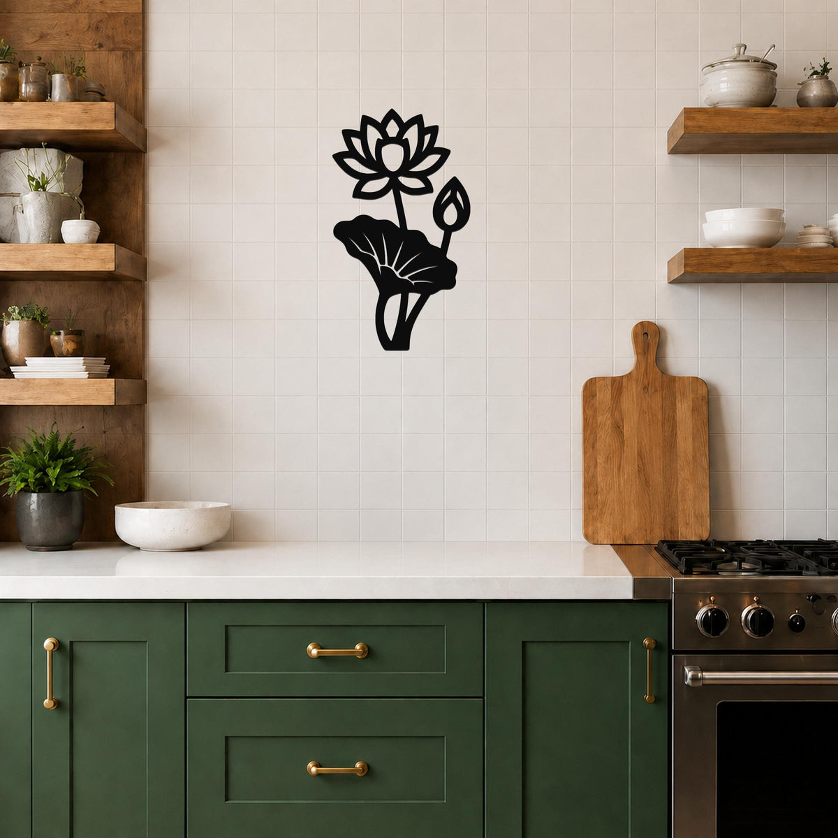 Black metal lotus flower wall art with a blooming flower, bud, and leaf cutout, mounted on a white tiled kitchen wall above a counter.