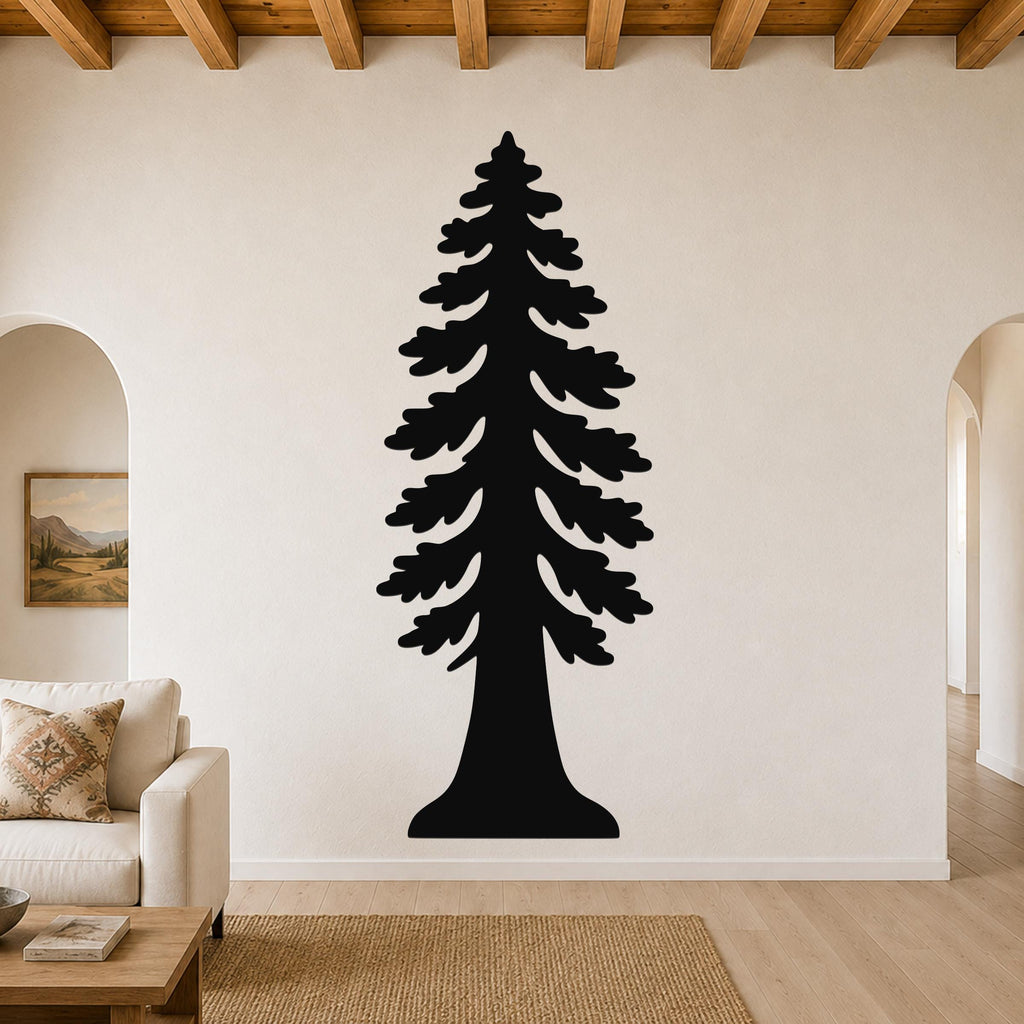 Black metal redwood tree wall art with layered branch cutouts, mounted on a living room wall above a sofa.