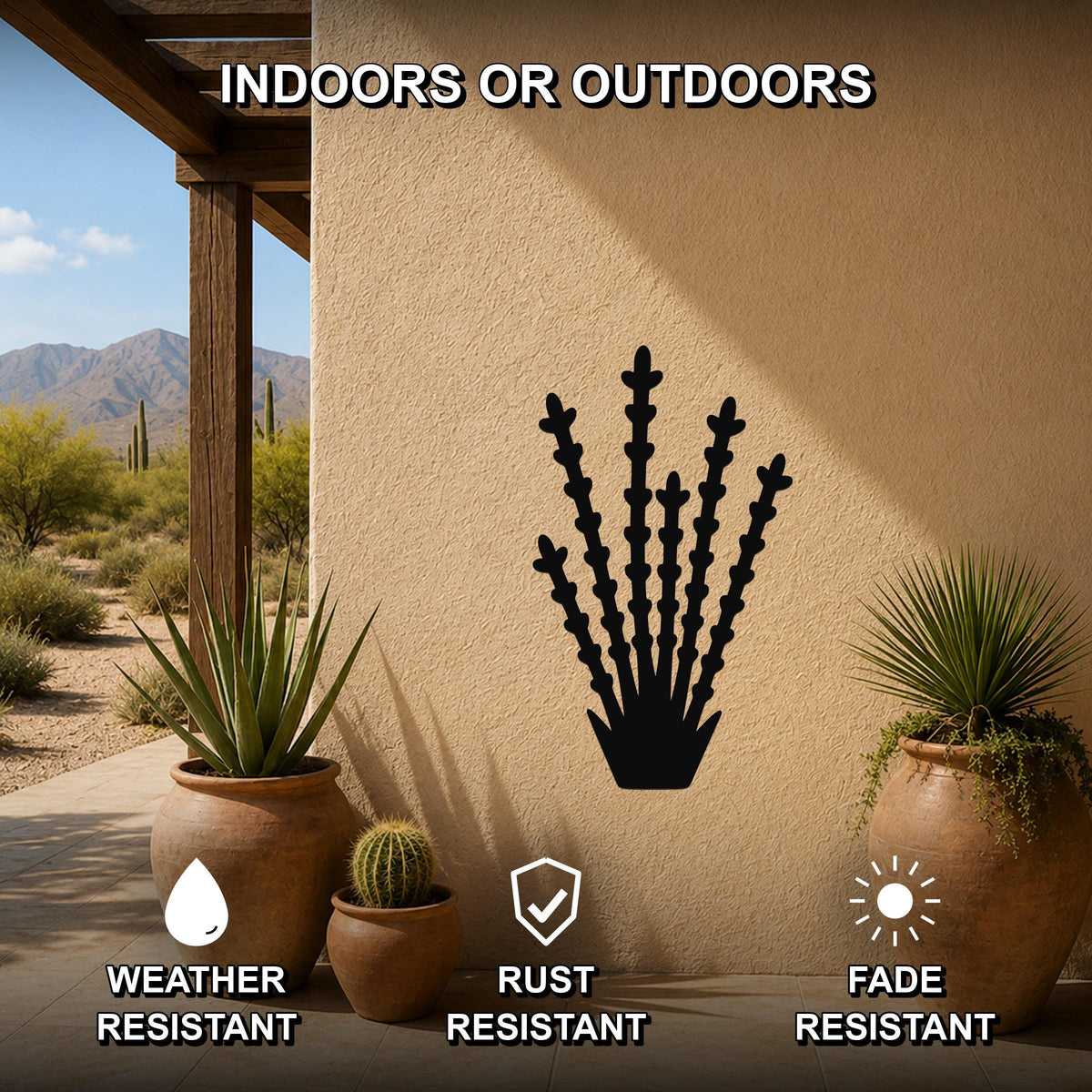 Black metal ocotillo wall art silhouette mounted on a stucco outdoor wall, displayed on a patio with potted plants and desert scenery in the background.