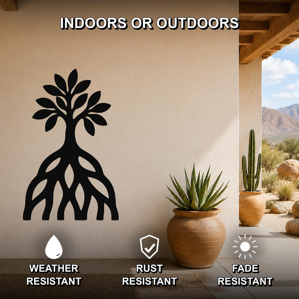 Black metal wall art silhouette of a mangrove tree with visible root system, mounted on a beige outdoor wall above a potted succulent on a patio.