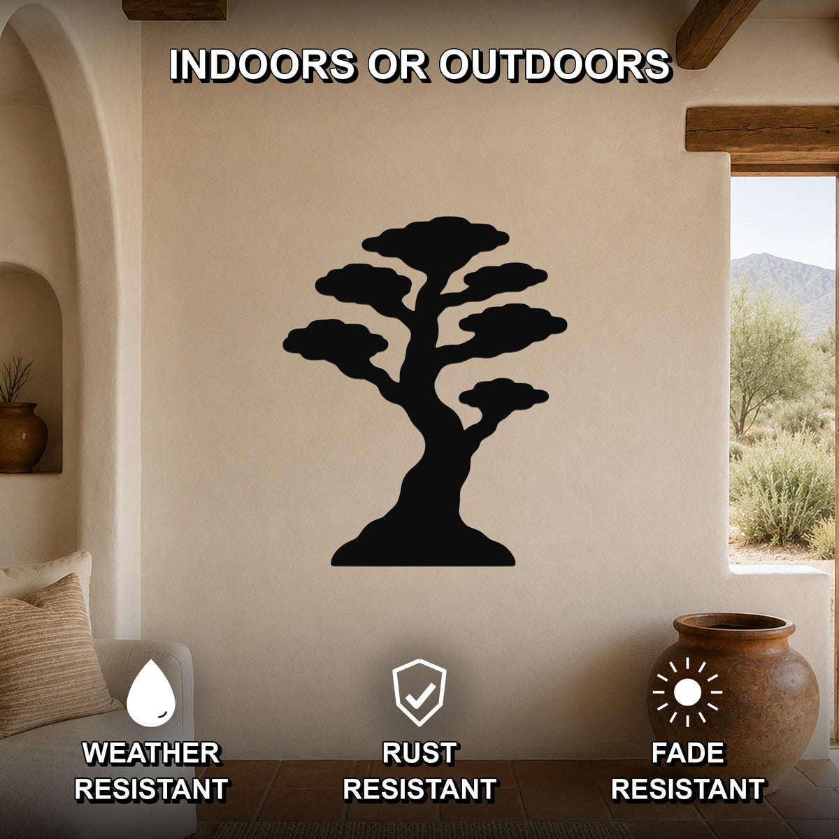 Black metal bonsai tree wall art silhouette mounted on a beige stucco wall in a living room, with text indicating it is weather, rust, and fade resistant for indoor or outdoor use.