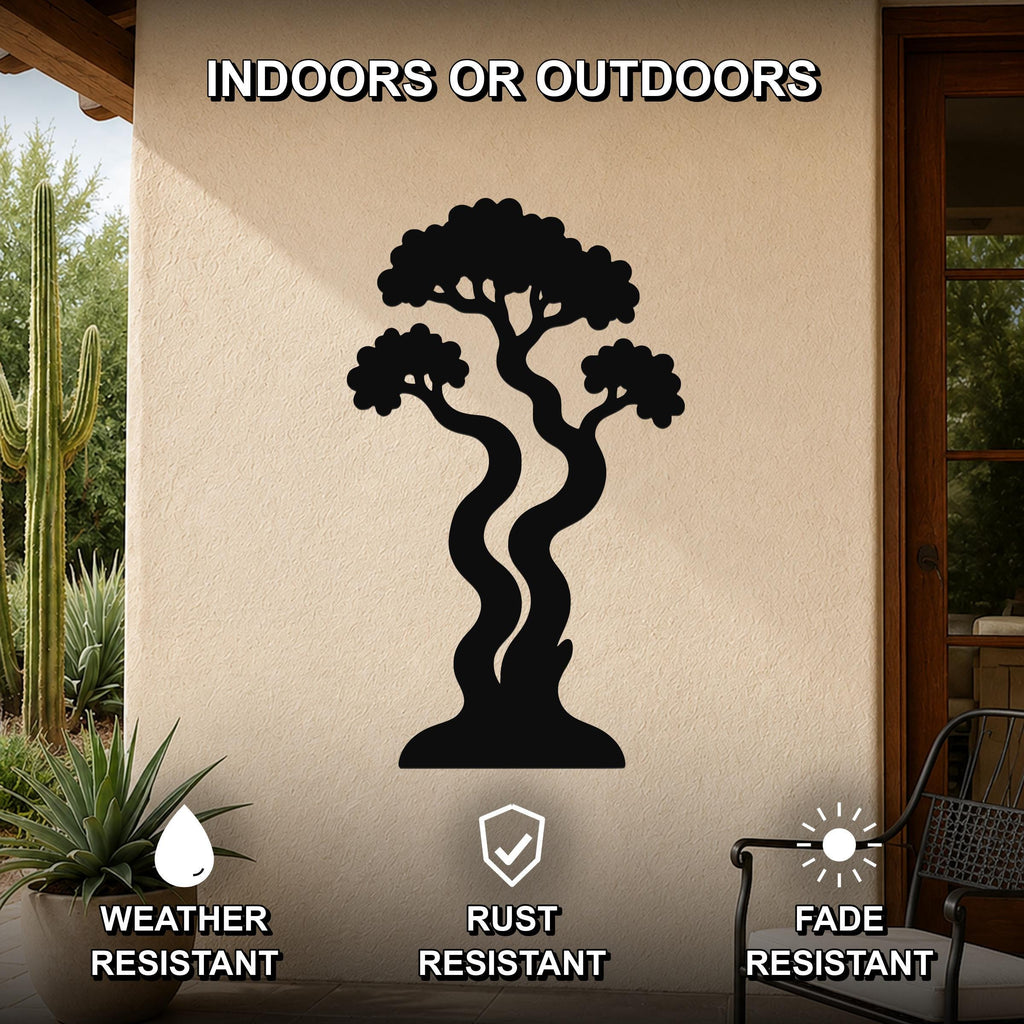 Black metal wall art in the silhouette of a bonsai tree with curved trunks and layered branches, mounted on an outdoor patio wall.