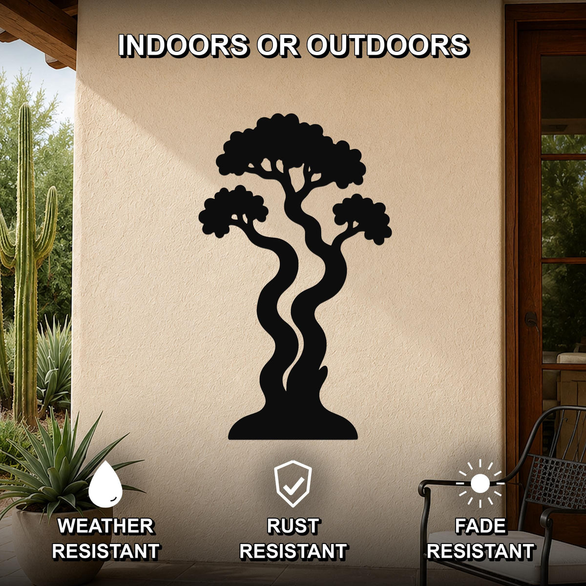 Black metal wall art in the silhouette of a bonsai tree with curved trunks and layered branches, mounted on an outdoor patio wall.