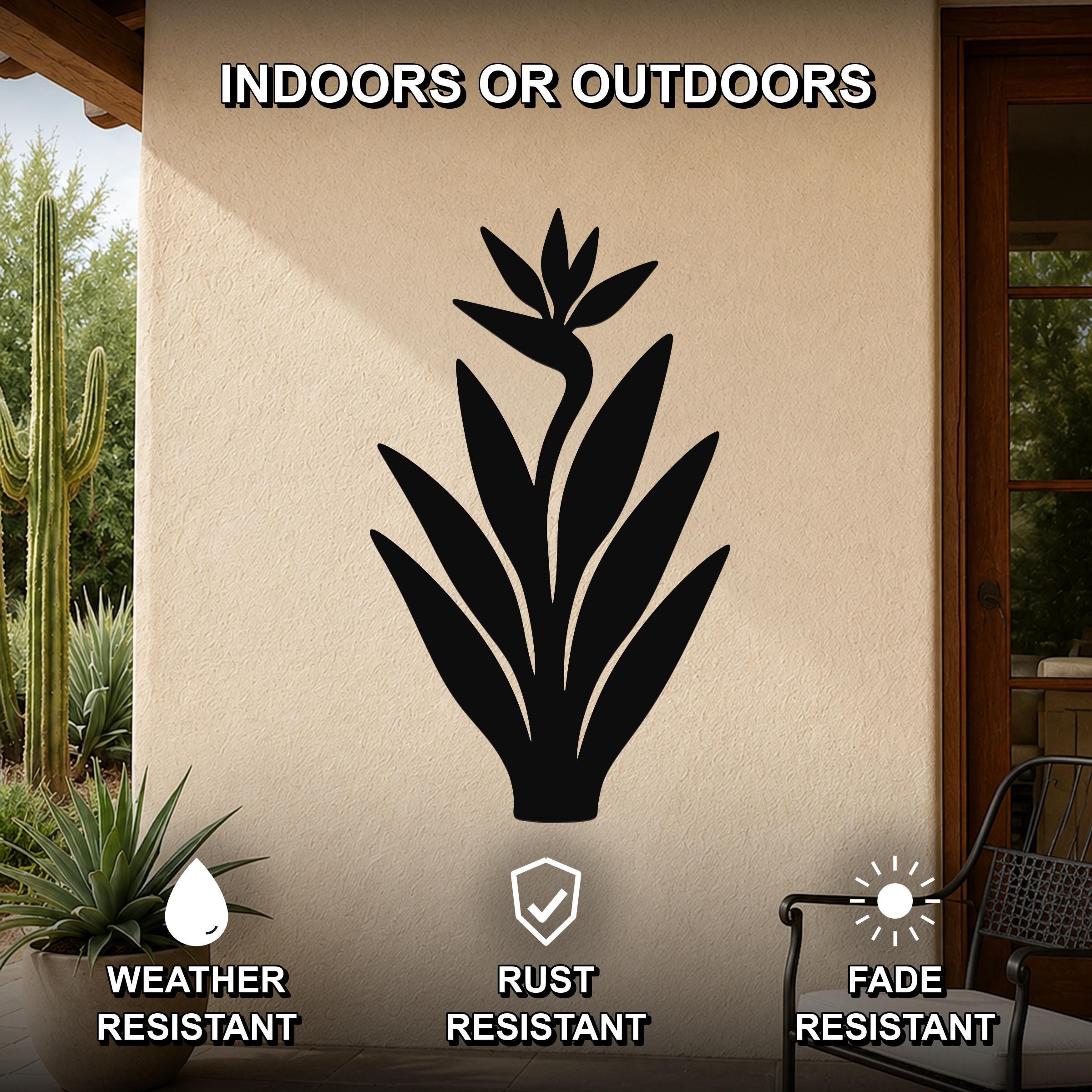 Black metal Bird of Paradise wall art silhouette mounted on an outdoor patio wall, weather resistant, rust resistant, and fade resistant.
