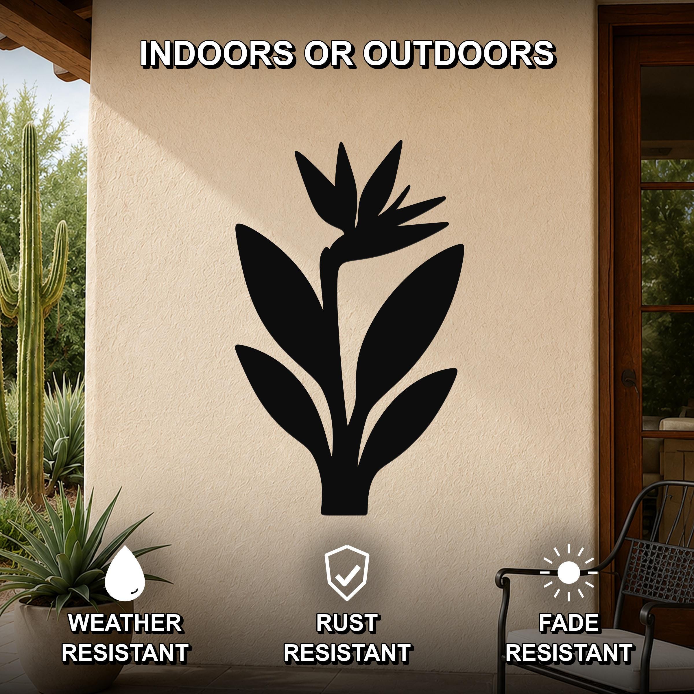 Black metal Bird of Paradise wall art silhouette mounted on an outdoor patio wall, weather resistant, rust resistant, and fade resistant.