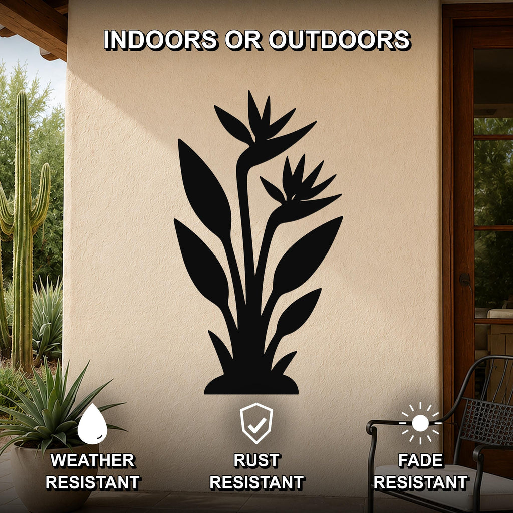 Black metal wall art of a Bird of Paradise plant silhouette, mounted on an outdoor patio wall with weather, rust, and fade resistance features.