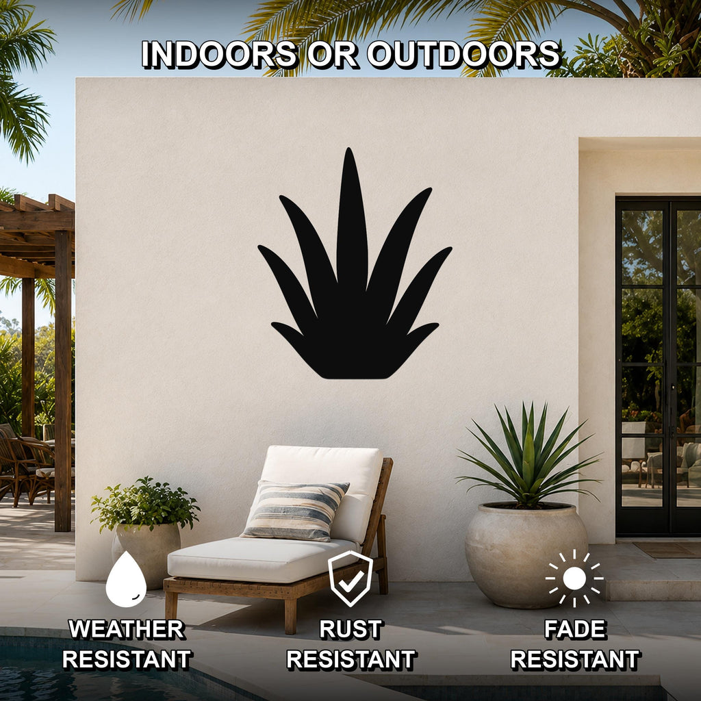 Black metal agave wall art silhouette mounted on an outdoor patio wall above a lounge chair, with visible weather, rust, and fade resistance icons.
