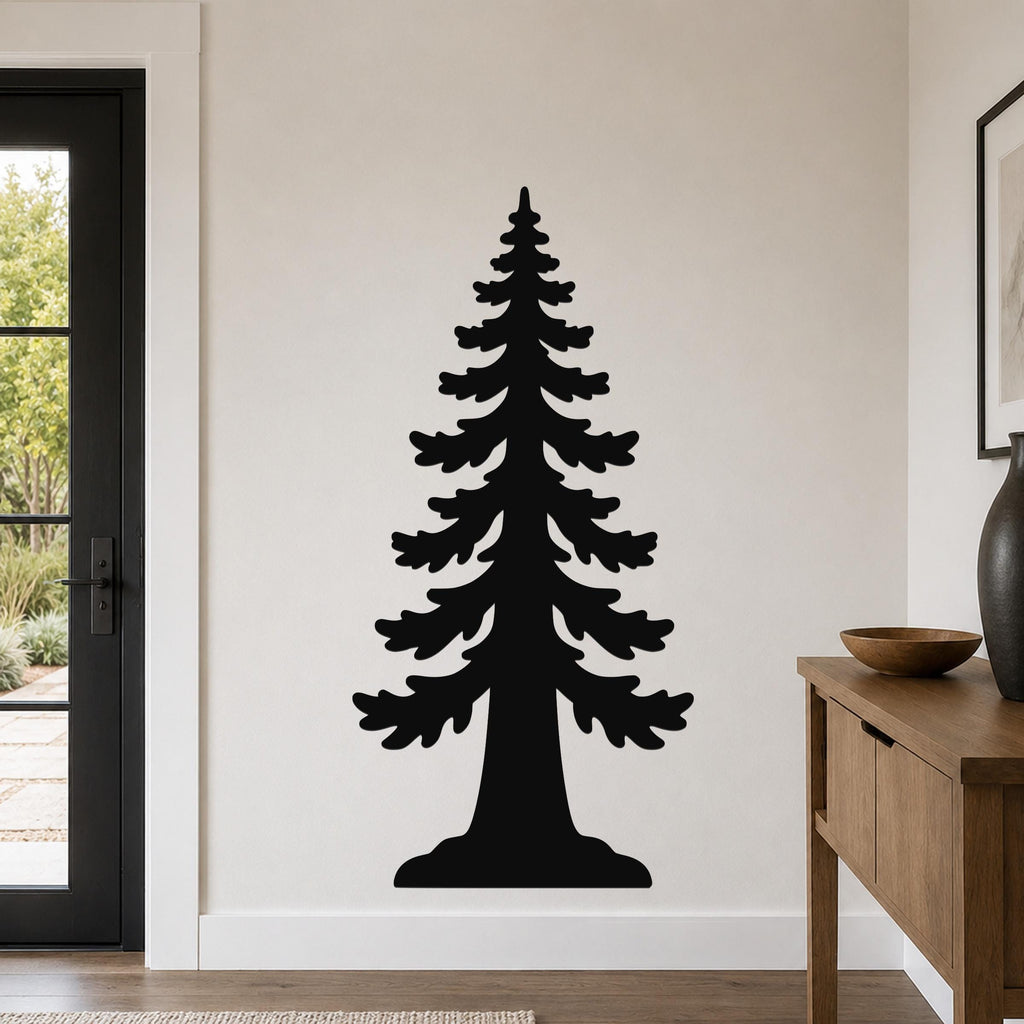 Black metal wall art of a sequoia tree silhouette, mounted on a light-colored wall in a living room near a door and wooden console table.