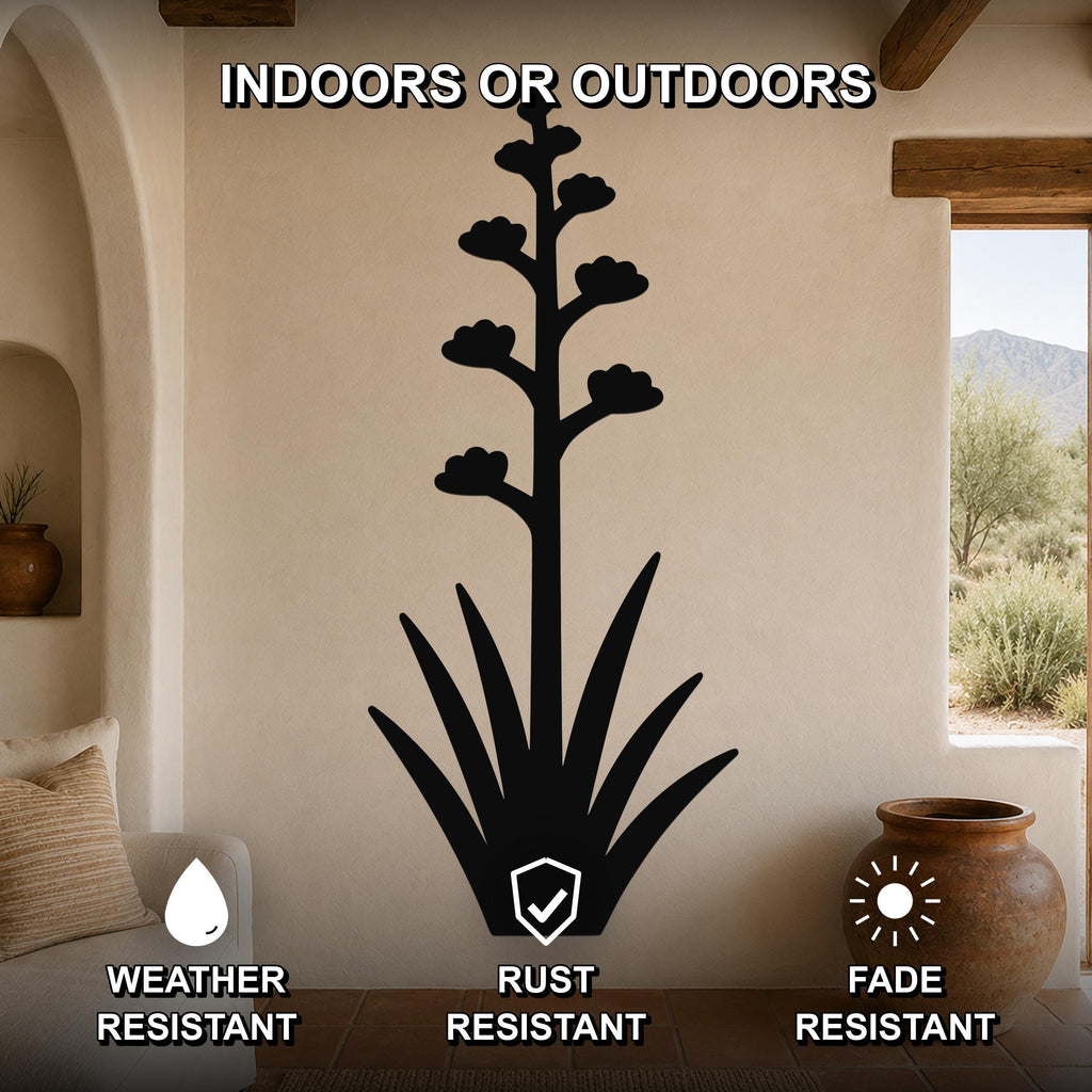 Black metal agave wall art with blooming flower cutouts, mounted on a beige living room wall above a sofa, weather, rust, and fade resistant.