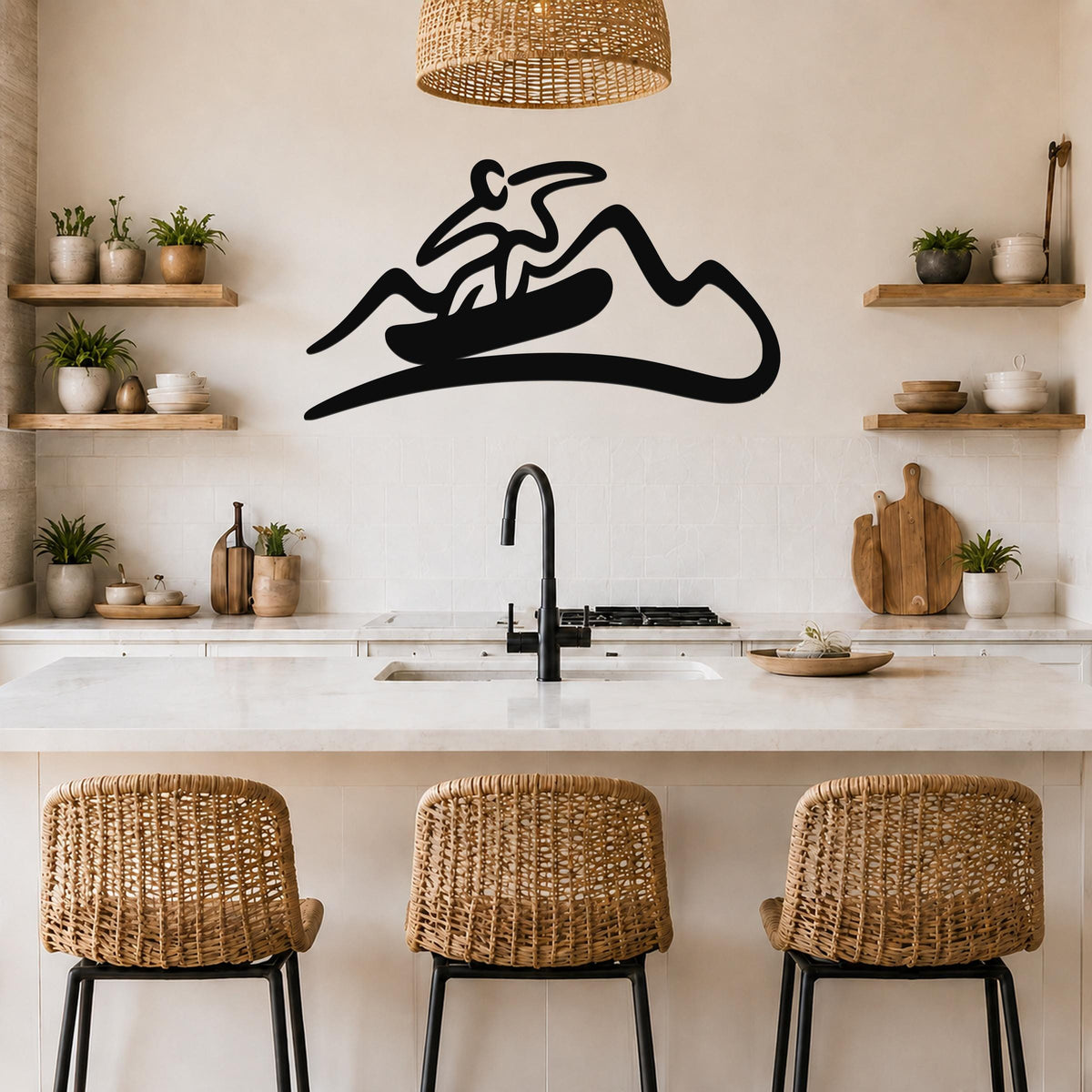 Black metal wall art silhouette of a snowboarder on a mountain, mounted above a kitchen counter with wicker stools and wooden shelves.