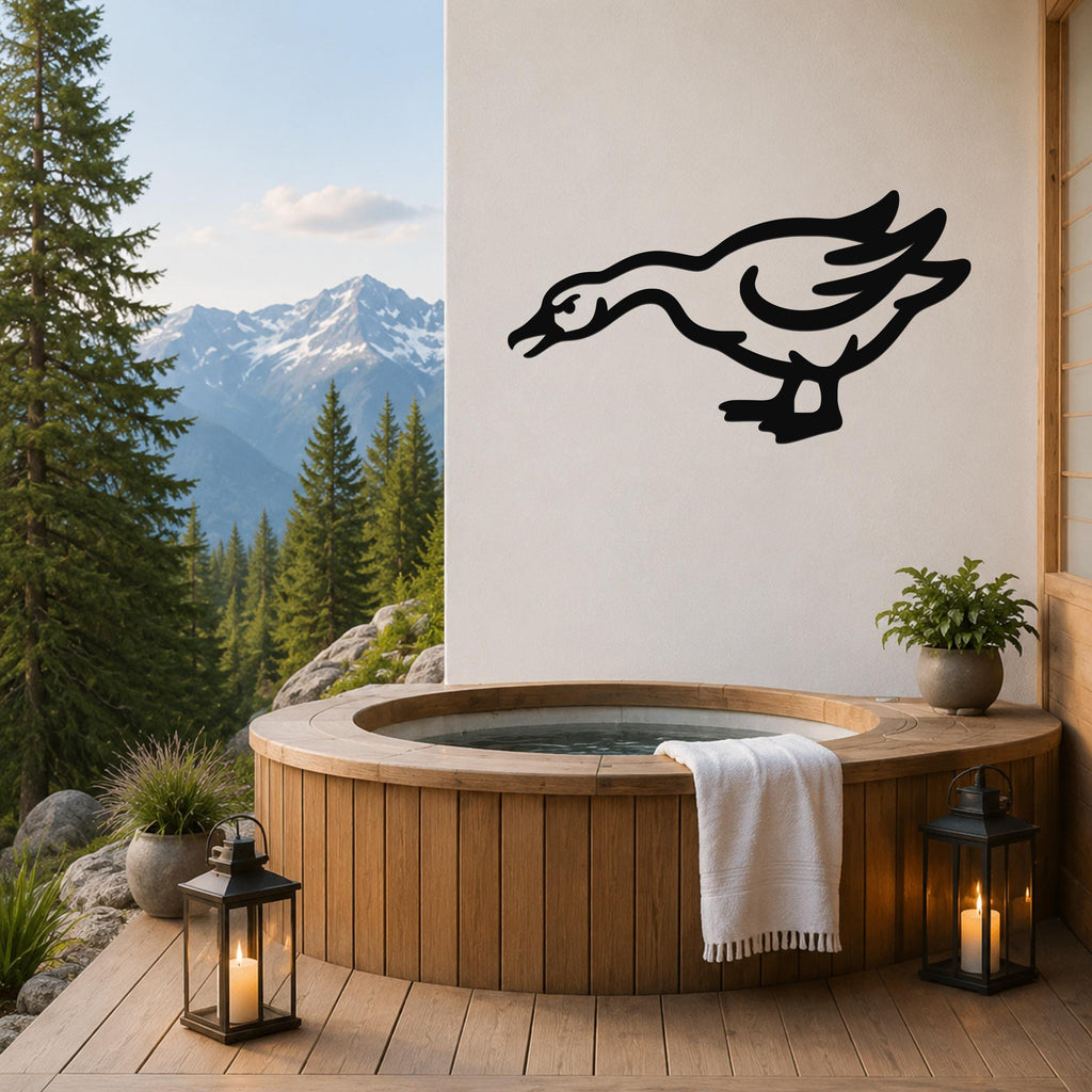 Black metal goose wall art with motion-line cutouts, mounted on a white wall above a wooden hot tub on a mountain-view deck.