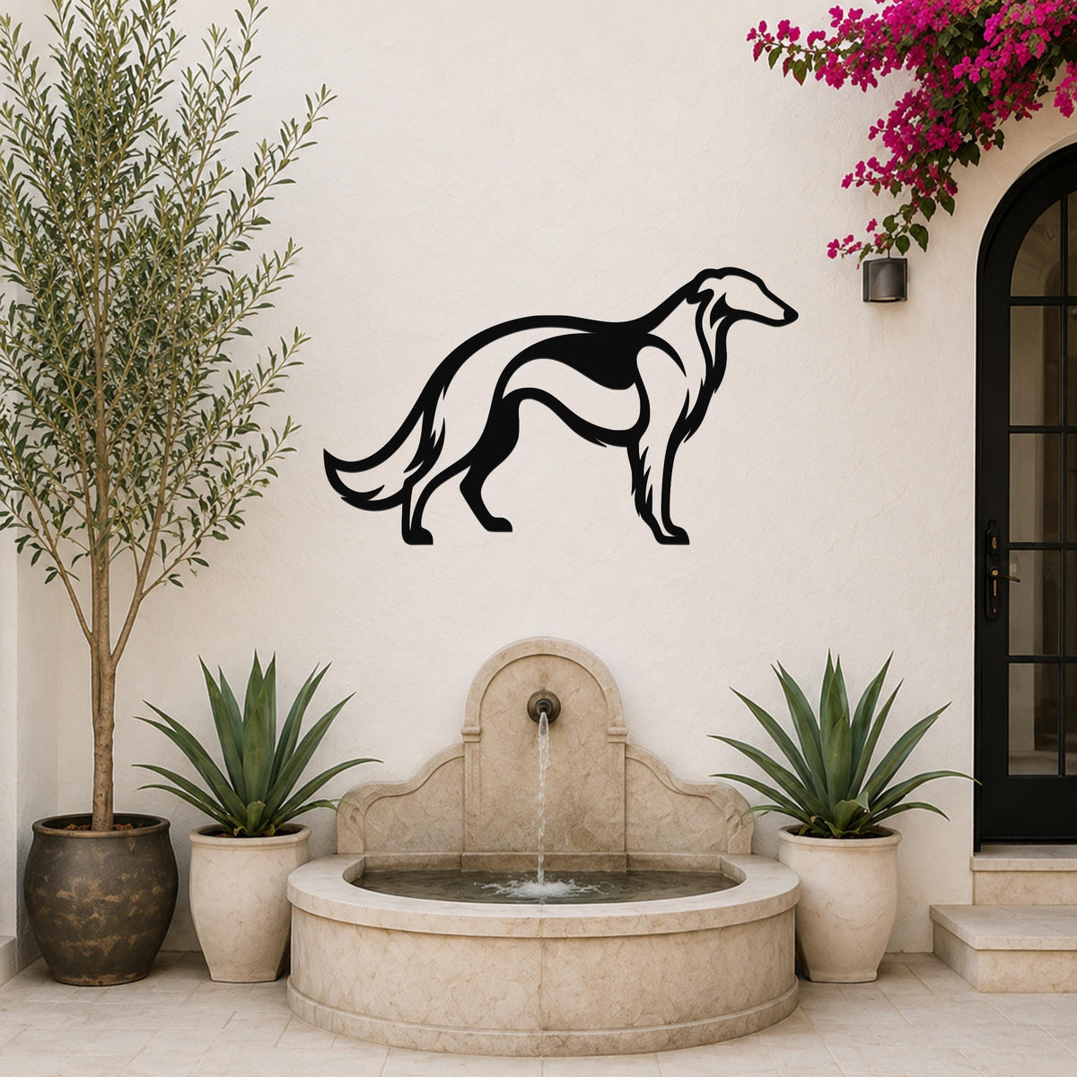 Black metal Borzoi dog wall art silhouette mounted on a white outdoor wall above a stone fountain, flanked by potted plants and a blooming vine.