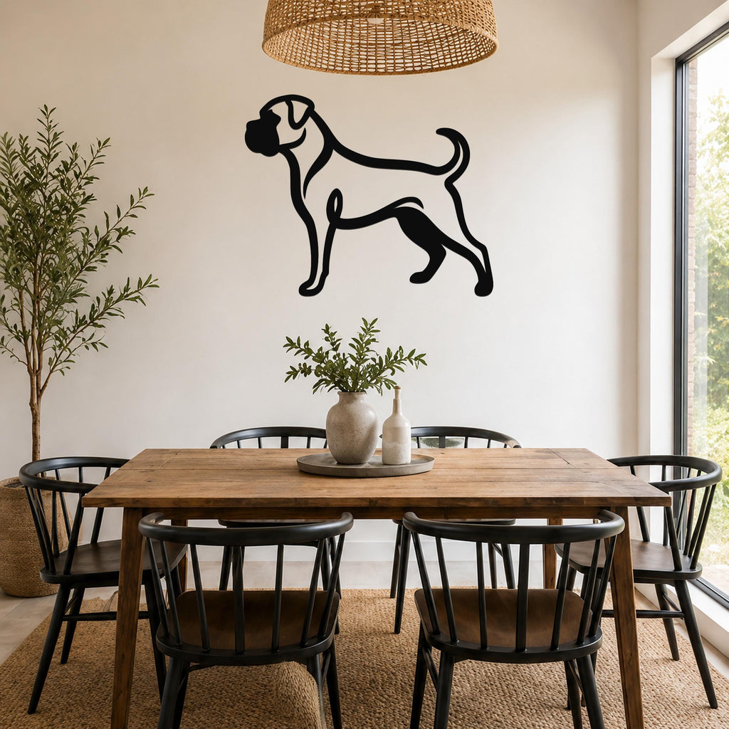Black metal Boxer dog silhouette wall art mounted on a white wall above a wooden dining table in a bright dining room.