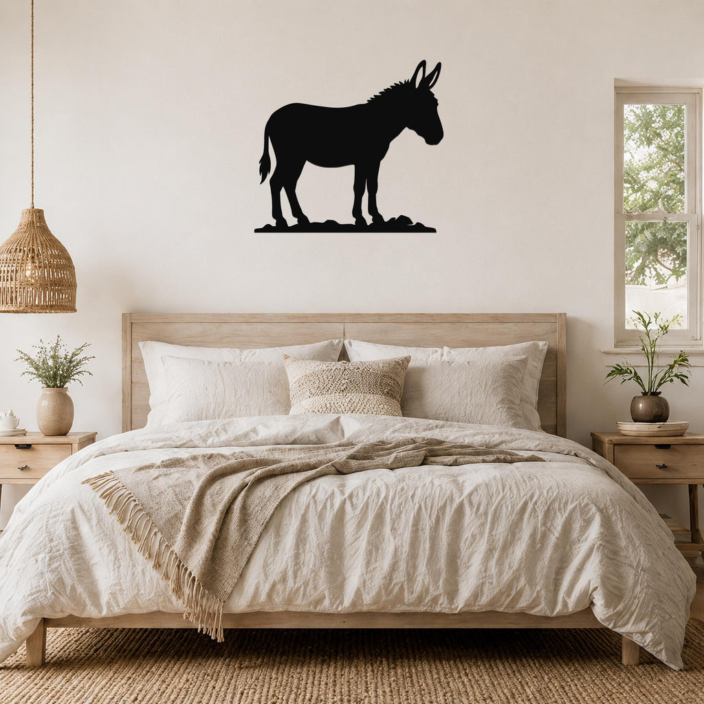Black metal donkey silhouette wall art mounted above a wooden bed in a neutral bedroom.
