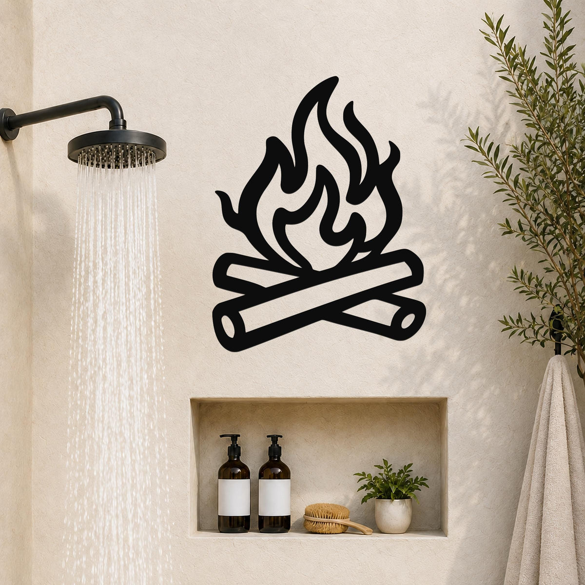 Black metal campfire wall art with flame and log silhouette, mounted on a bathroom wall above a built-in shelf.