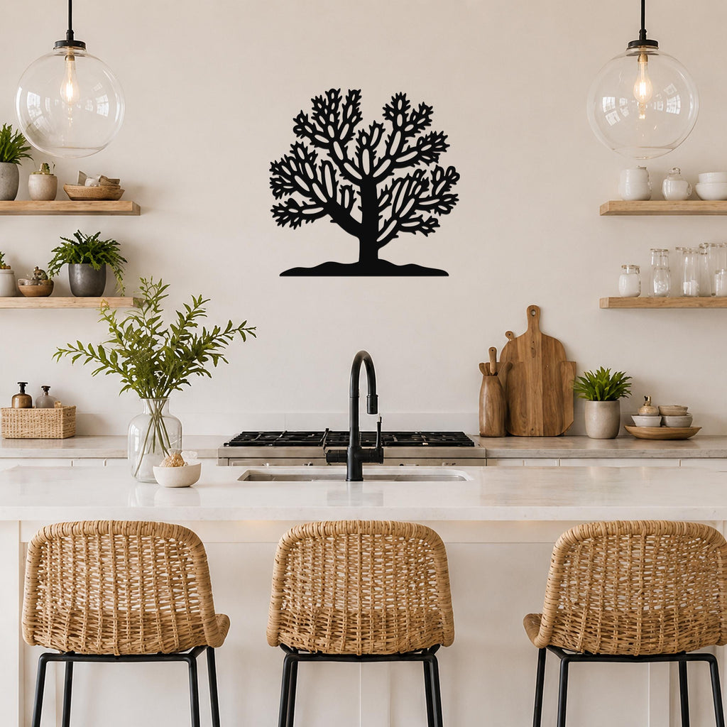 Black metal Cholla cactus wall art silhouette with intricate branch cutouts, mounted on a kitchen wall above a counter.