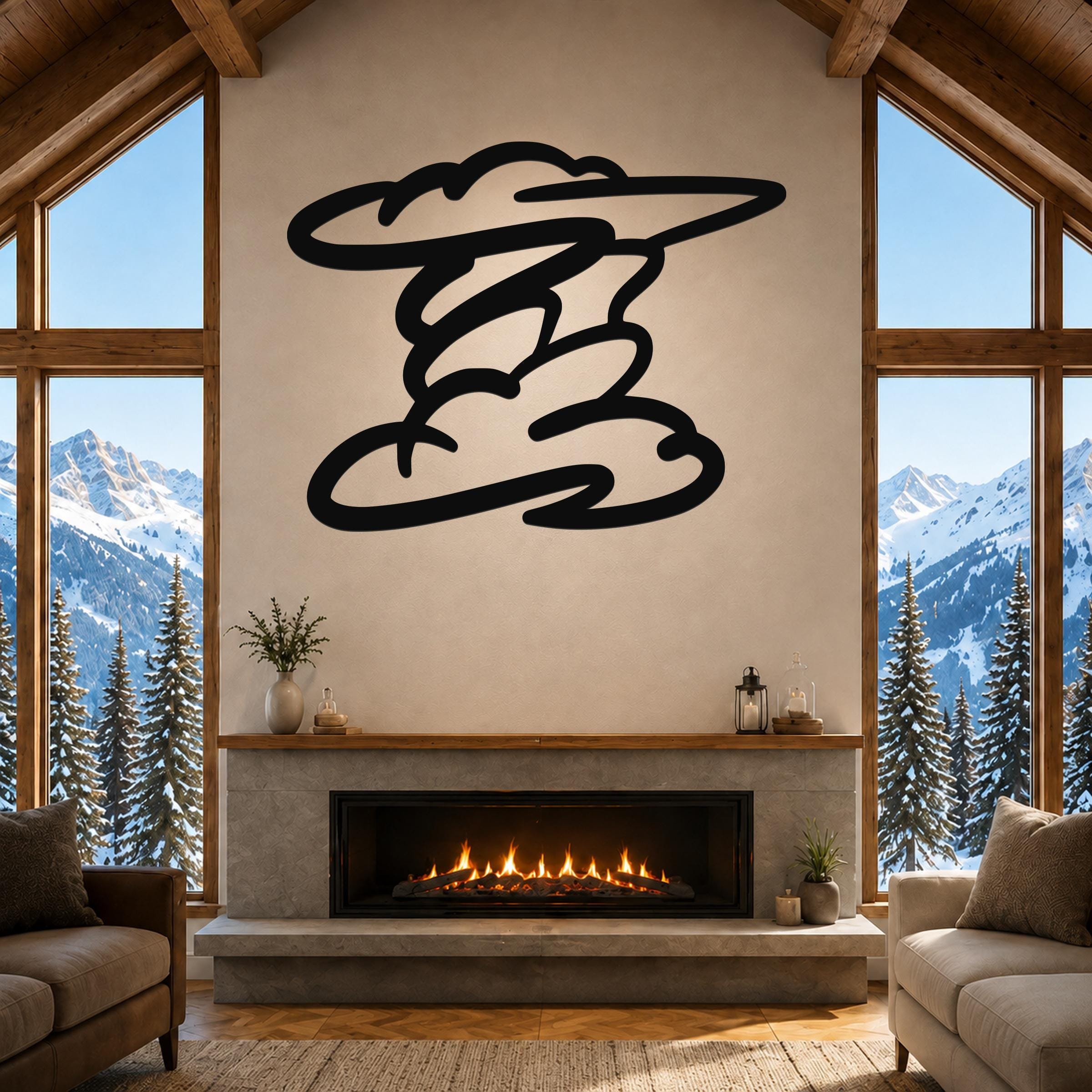 Black metal cloud wall art with flowing, layered cutouts, mounted above a fireplace in a living room with large windows and mountain views.